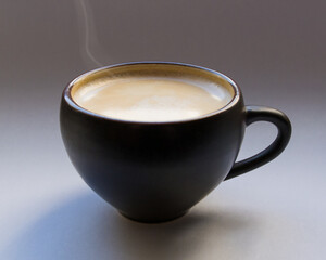 freshly made coffee with milk. Steam above the surface of the drink. Cup of cappuccino