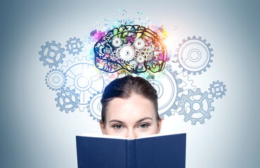 Woman with book and brain sketch