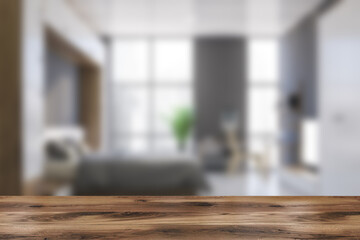 Table in blurry white master bedroom