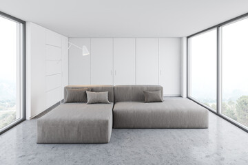 White living room with sofa and wardrobe