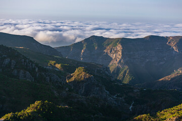 Views of the Sierra Almijara, Tejeda and Alhama from the viewpoint of the highway of the goat, with low clouds that cover the tops of the mountains, creating a panoramic view of a sea of clouds.