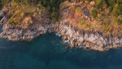 Obraz premium Aerial view. Top view of turquoise sea water washes the rocky shore. Landscape background. Thailand