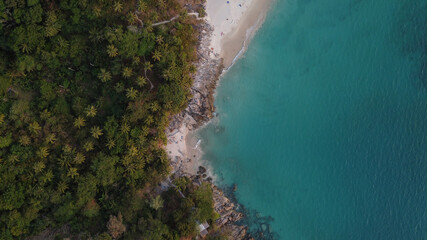 Aerial view. Top view of tropical island forest and white sand beach with turquoise sea water in Thailand.