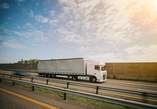Truck transport on motorway in motion 
