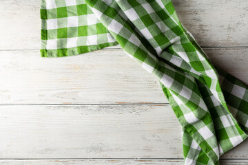 Fototapeta na wymiar Green kitchen towel on white table, italian food background