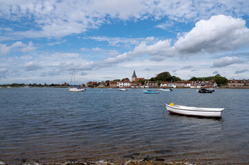 Bosham Village photo from the south side of the harbour with boats and yachts in view.