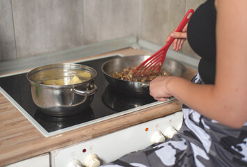 young woman preparing a meal in the kitchen