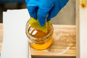 Applying linseed oil to wood.
