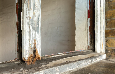 Closeup of rotten sash window frame.