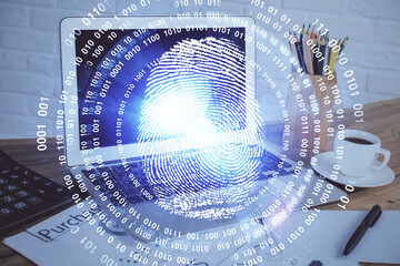 Computer on desktop in office with finger print drawing. Double exposure. Concept of business data security.