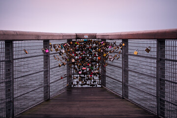 padlocks on a bridge over the sea