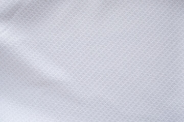 Obraz na płótnie Canvas White sports clothing fabric football shirt jersey texture abstract background