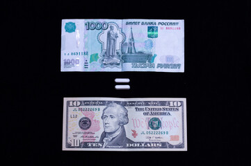 ten dollar bill and one thousand rubles on a black background with an equal sign. The concept of the growth of the dollar to one hundred rubles