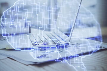 Multi exposure of work space with computer and human brain hologram. Brainstorm concept.
