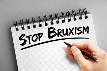 Text note - Stop Bruxism, health concept on notepad