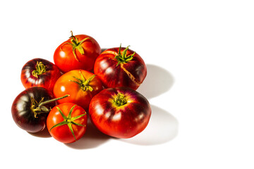 Close up view of ripe red tomatoes isolated on white background. Organic vegetables concept.