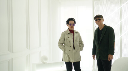 Asian senior elder hipster couple wearing stylish fashion winter dress white background copy space