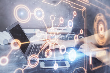 Social network theme hologram with businessman working on computer on background. Concept of world wide web. Double exposure.