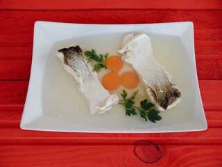 Traditional Romanian cold food prepared from fish and decorated with parsley and carrot slices