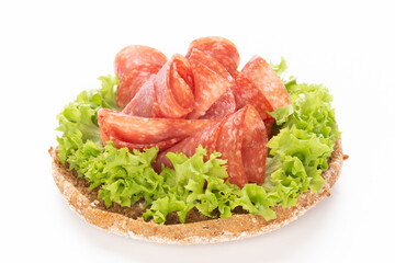 Sandwich with salami sausage on white background.