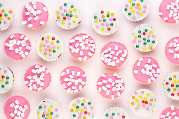 Colorful cupcakes on a white background.