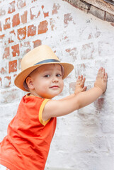 Portrait of a boy in a hat. A child poses in a beautiful hat.	

