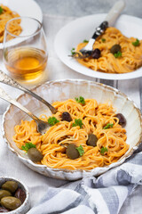 spaghetti in creamy tomato sauce with olives