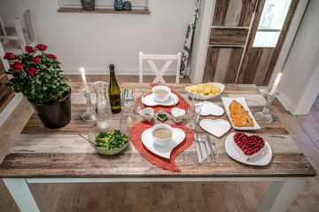 Valentines day dinner setting romantic love for two wooden table red heart shape candle light with roses