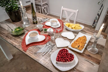 Valentines day dinner setting romantic love for two wooden table red heart shape candle light with roses