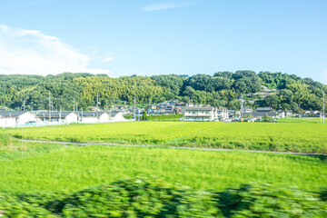 Fototapeta na wymiar 列車の車窓から見る風景
