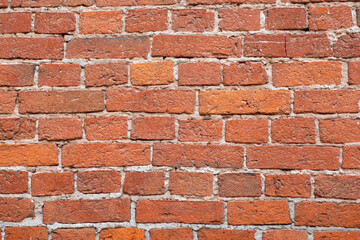 Old brick marable wall. Brickwork from an old marable stone  in a rustic style. The structure and pattern of the destroyed stone wall. Copy space..