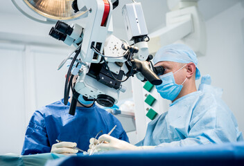 A team of surgeons performing brain surgery to remove a tumor.