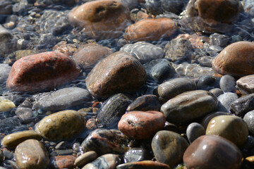 Tumbled stones along water's edge