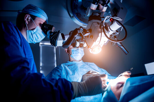 A team of surgeons performing brain surgery to remove a tumor.