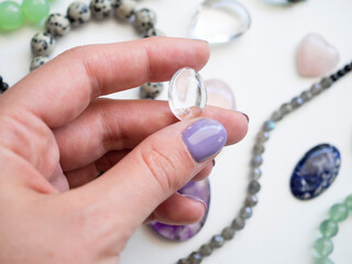 Natural white quartz pendant in a woman's hand