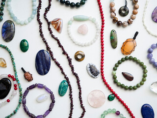 Multicolored semi-precious stones on a white background