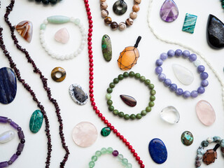 Multicolored semi-precious stones on a white background