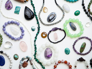 Multicolored semi-precious stones on a white background