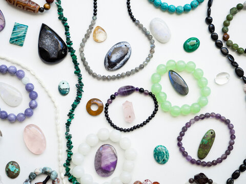 Multicolored semi-precious minerals, bracelets and pendants made of natural stones