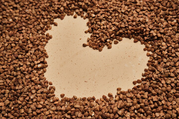 buckwheat on a backdrop. rustic buckwheat background. buckwheat heart sign.