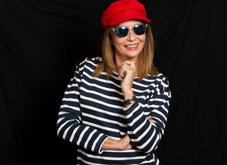 beautiful blonde woman with black background and sunglasses