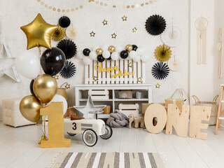 Birthday decorations - gifts, toys, balloons, garland and figure for little baby party on a white...