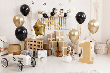 Birthday decorations - gifts, toys, balloons, garland and figure for little baby party on a white...