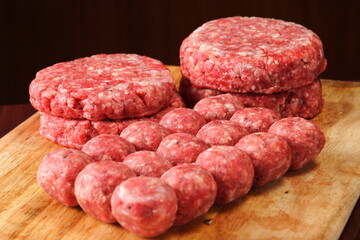 raw minced meat on wooden board