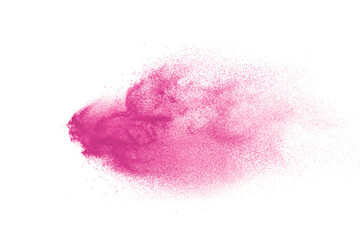 Freeze motion of pink color powder exploding on white  background. 