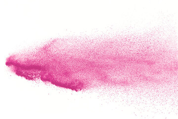 Freeze motion of pink color powder exploding on white  background. 