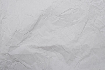 Crumpled white paper background.