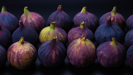 Tasty figs on a black background. Top view.