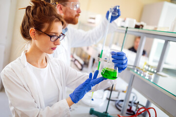 Group of medical scientists working at laboratory. Science, chemistry, medicine and people concept