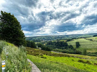 Fototapeta na wymiar Landscape view, from Black Moor Road, over the fields and meadows near, Haworth, Keighley, UK
